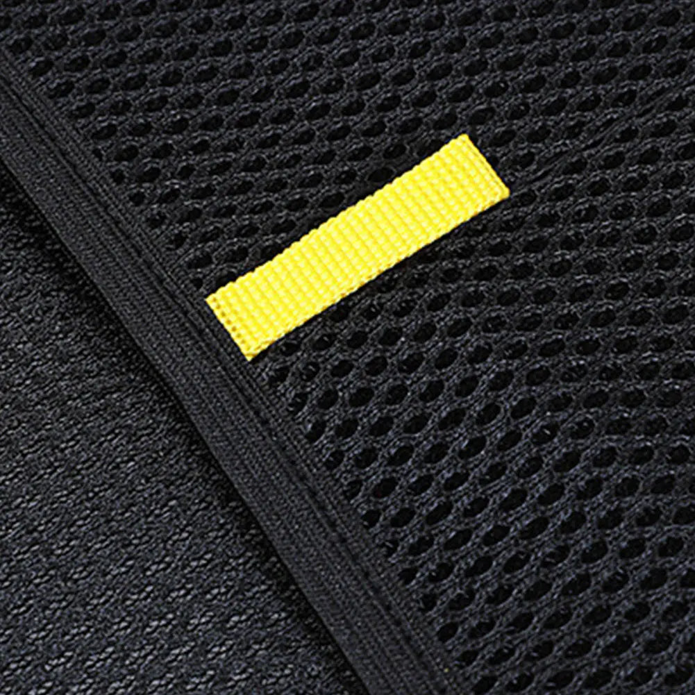 Close-up of black mesh fabric with a yellow strip, durable texture detail