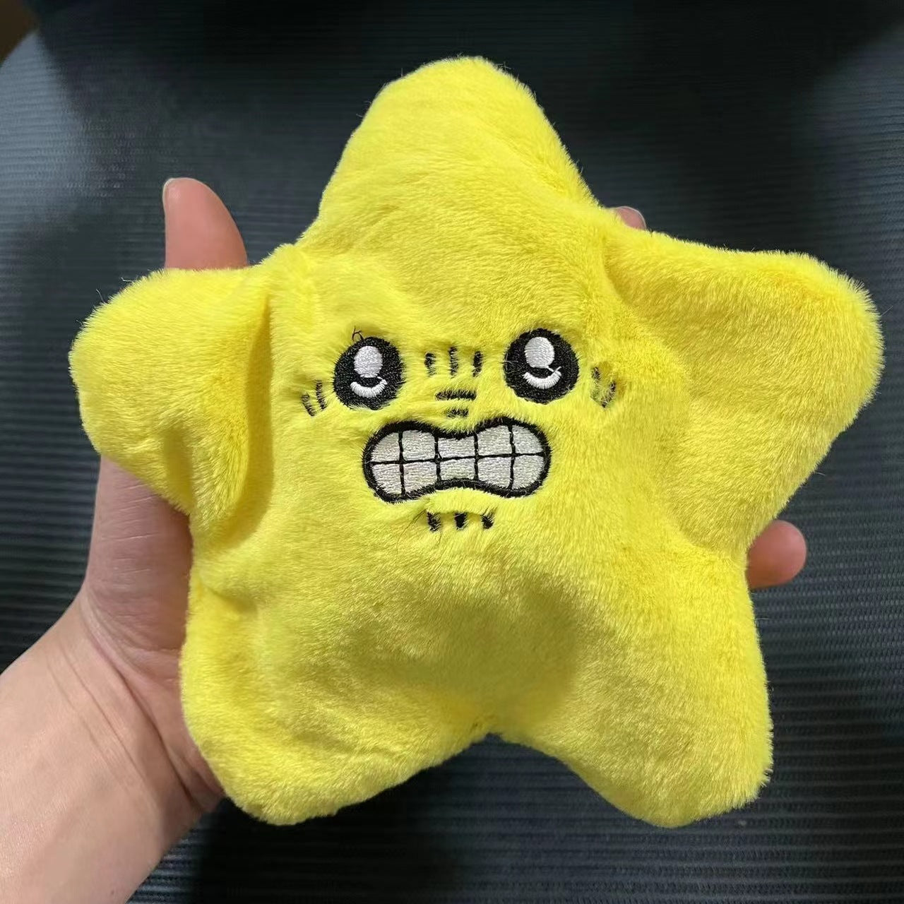 Yellow star-shaped plush toy with expressive embroidered face, cozy kids gift