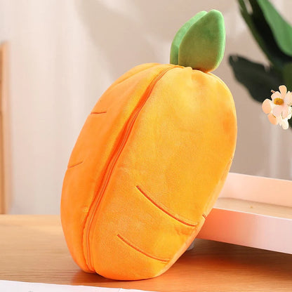 Plush carrot-shaped pillow toy with green leaf detail on a wooden table