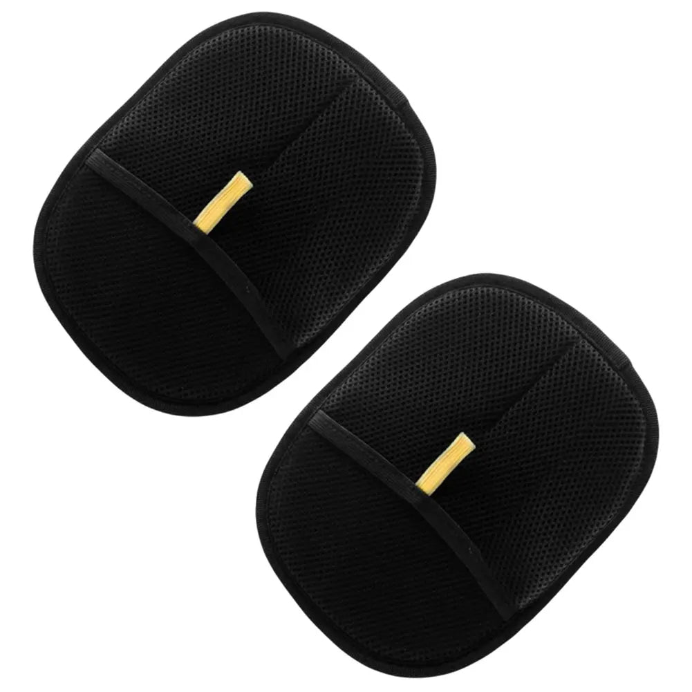 Pair of black mesh exfoliating bath gloves with thumb slots on white background
