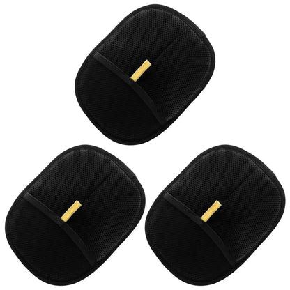 Set of three black exfoliating bath gloves with textured surface on white background